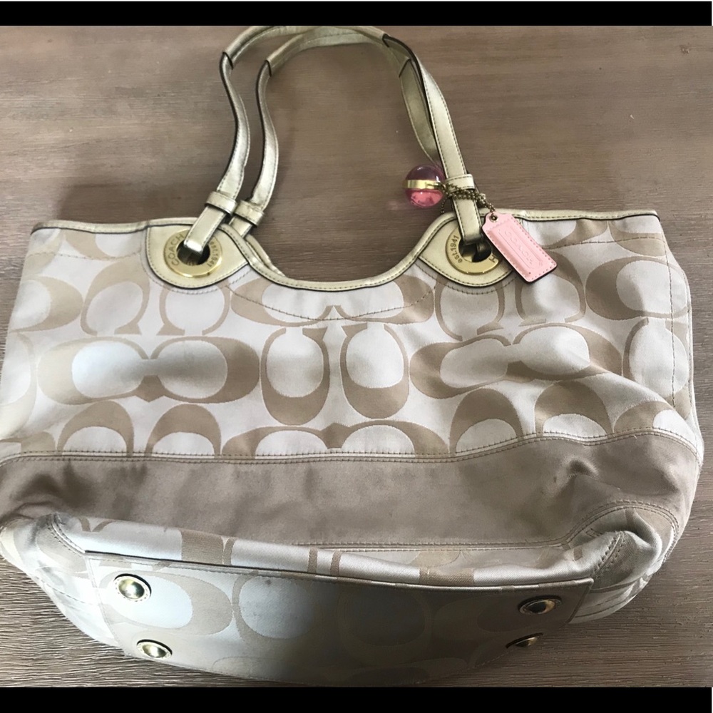 Tan and gold Coach purse